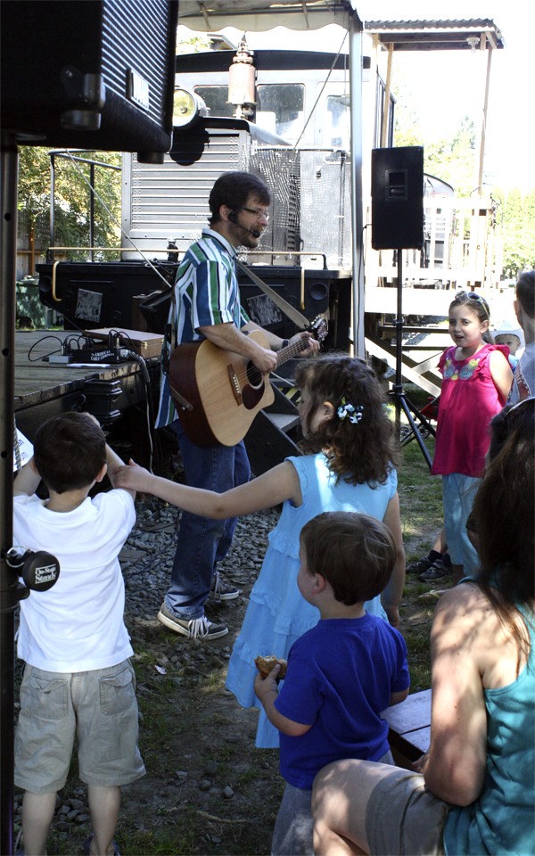 Children’s entertainer Eric Ode plays music for the younger set at the Railroad Days Kids’ Stage