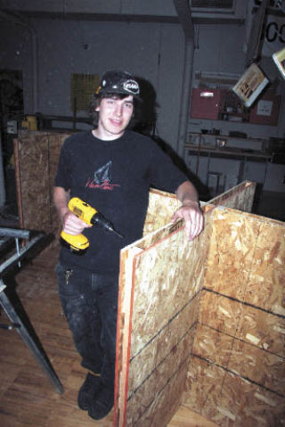 Mount Si student Jake Huber makes wooden displays for the Festival of the Arts in his career classes at Mount Si. The plywood displays were made through a student-run contract and will hold arts from the community at the centennial Festival at Mount Si.