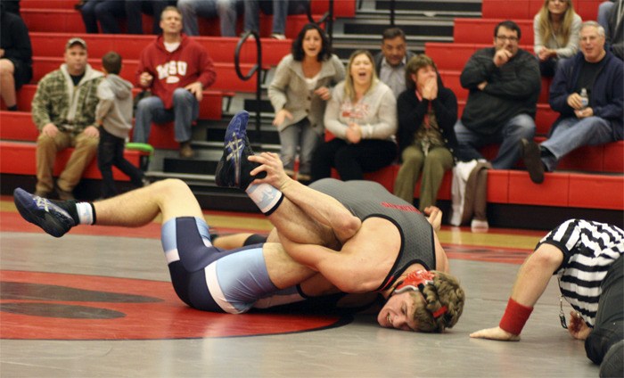 The crowd reacts as Mount Si 160-pounder AJ Brevick locks up Interlake’s Jacob Marks. Brevick was down by four points in the final seconds of his match