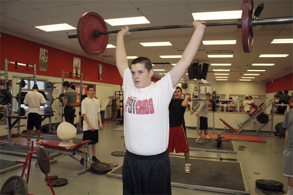 Ninth grader Rory Walter hefts a barbell Monday