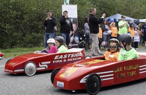Amber Thompson and Addison Fischer (left) race Danny Vukovich and Lucy Weed on Snoqualmie Parkway Saturday