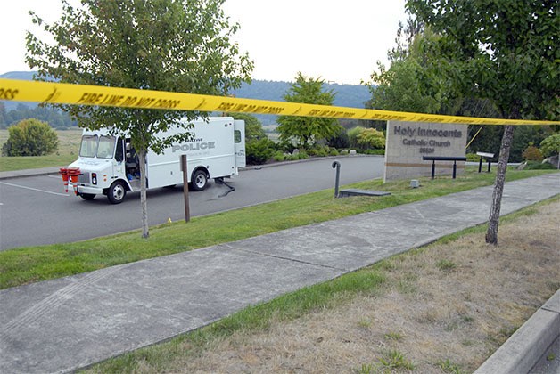 Police blocked off the Holy Innocents Church parking lot in Duvall