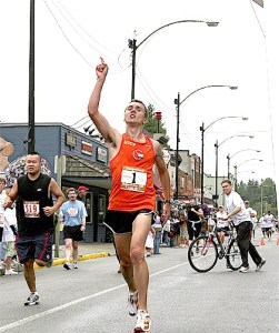 Raising a “1” sign in triumph