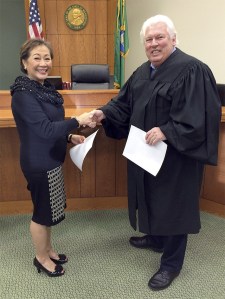 Emma Herron is sworn into office Dec. 9 by Judge Peter Nault.