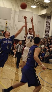 Cedarcrest sophomore Zach Taylor fires a long shot for a three during first-half action Friday