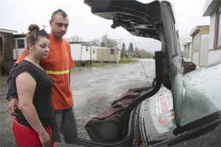 Closing their filled trunk