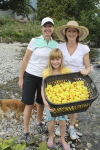 Volunteers get ready to start the Duck Derby in North Bend. Winners get prizes. This year's beneficiary is a local camp for children with burns.
