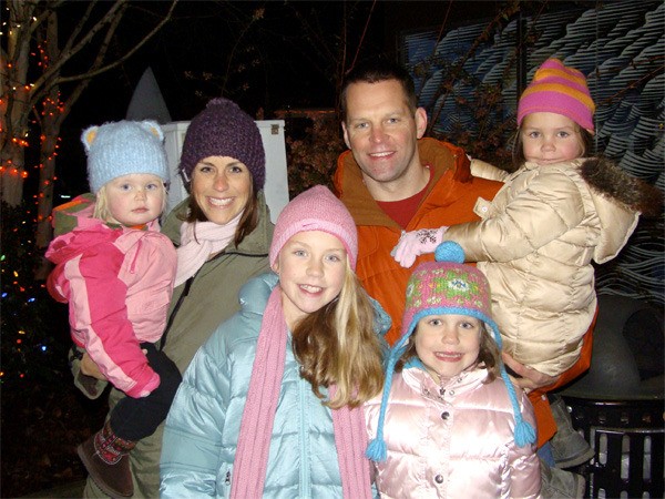 A family shares smiles at the Christmas in Carnation celebration