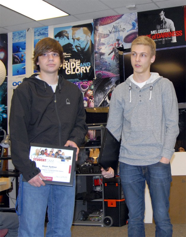 Film-makers Dean Sydnor and Emmitt Rudd receiving plaques for their work in the C-SPAN video competition.