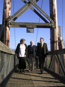 Carnation Mayor Lee Grumman escorts King County Executive Dow Constantine across the Tolt-McDonald Park suspension bridge. Constantine