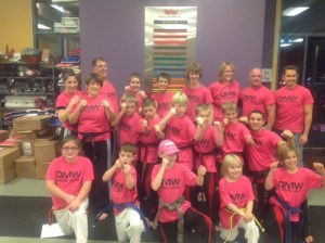 Students at Snoqualmie’s DMW Martial Arts show their physique during the week of Kickathon