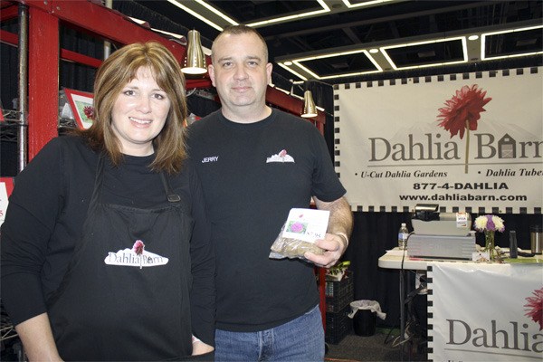 Years of trade show experience are paying off for North Bend's Aimee and Jerry Sherrill. Selling hand-bagged tubers from their Dahlia Barn booth