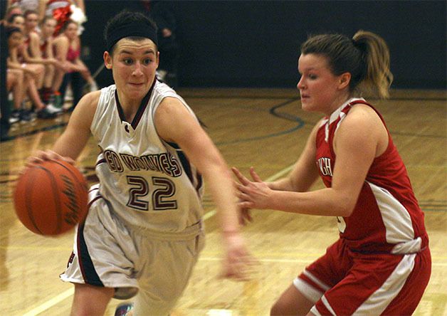Cedarcrest's Susan Kenney drives past a Red Raider foe last Friday