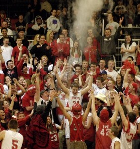 Wildcat senior Luc Zupan enters a crowd of fans after being introduced at the start of the Tuesday Feb. 9