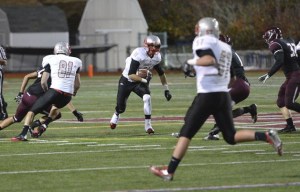 Mount Si’s Trent Riley makes his way through the Mercer Island defense during play Friday