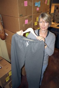 Andrea Williamson holds up a pair of her bestselling sweatpants