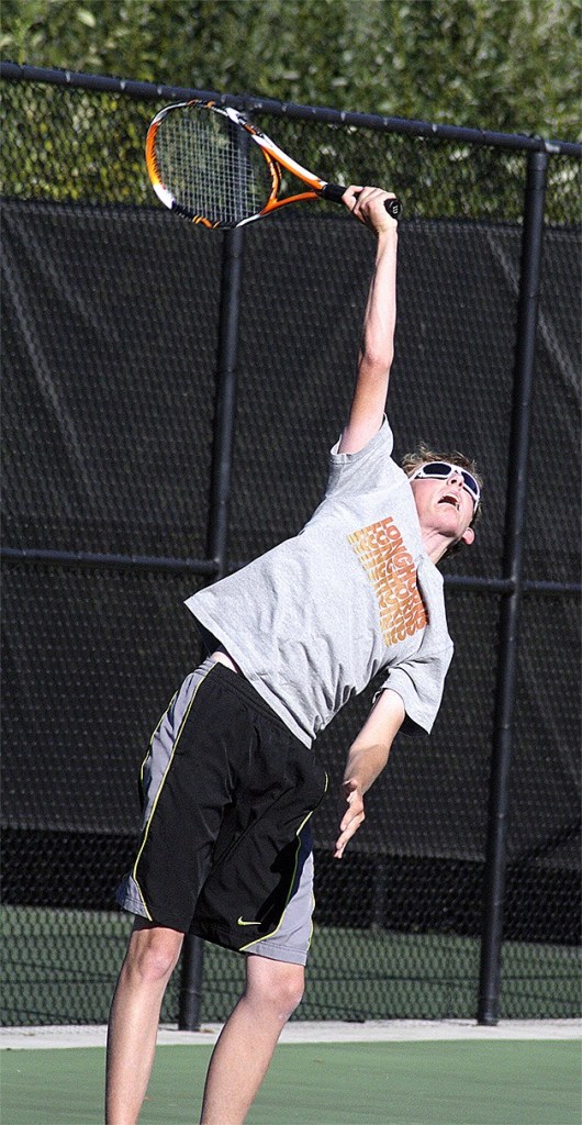 Mount Si junior John Day fires a serve during the 2014 season. Day grew in the season and represented at the league tournament at Skyline.