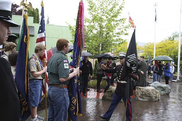 Boy Scouts get some last-minute instructions in carrying the colors during the Memorial Day procession Monday