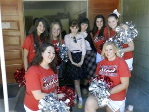 Cheerleaders mingle with costumed fans during Valley's Twin Peaks Fest