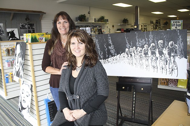 Outgoing Cascade Office Supply owner Stephanie Huber  stands behind new owner and entrepreneur Donna Hayes