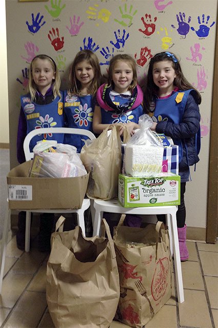 Daisy Troop 44293 from Snoqualmie Valley recently earned their Rose petal by “making the world a better place.” From left