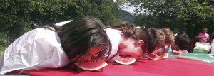 Young and hungry contestants dive into the watermelon eating contest at the 2013 Fall City Days. Young Life hosts this year.
