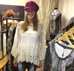 Model Kylan Ooyman tries on one of her show outfits at a fitting appointment for the upcoming Fall Fashion Show