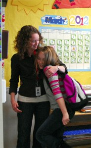Elizabeth Cronin gets a hug from one of her fourth graders at Cascade View Elementary School