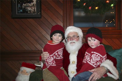 Santa greets warmly dressed youngsters at the Snoqualmie Depot at a past Santa Train excursion.