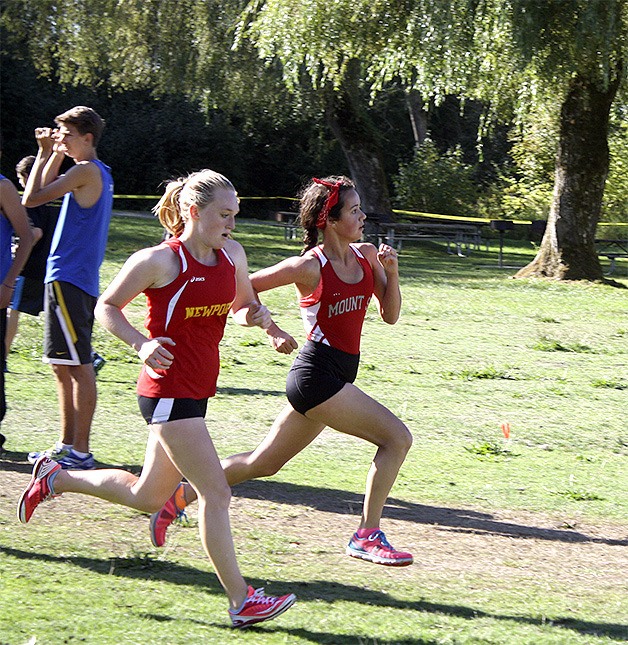 Mount Si freshman Julene McDonald passes a runner in the final leg. “It was tiring but a lot of fun