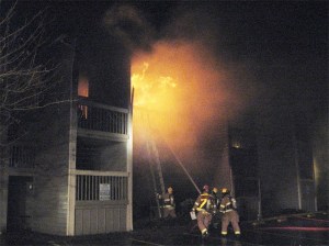 Firefighters battle a wind-fueled blaze that gutted units at the Mount Si Court Apartments on Thanksgiving in North Bend. Onlookers described bursts of flame shooting out of the building. One neighbor and a sheriff’s deputy were injured.