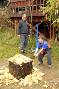 Martial-arts student Austin Tiernan sends pumpkin pieces flying with a determined swing of his sword