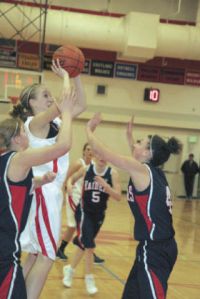 Mount Si’s Aubrey Larion fights through a press of Raiders during Tuesday’s home match. Nathan Hale took the win in the Wildcat’s final game of the season.