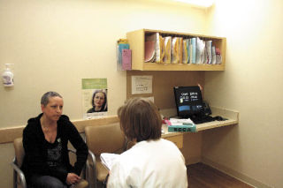 Living with cancer means many trips to the doctor’s office for Lisa Newell of North Bend. Newell learns that her cancer hasn’t spread but will require another three months of chemotherapy at the Seattle Cancer Care Alliance.