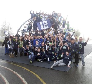 The fifth grade class at Cascade View Elementary show their 12th Man spirit. This photo was taken on the school playground on Friday