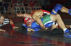 Mount Si junior John Farmer locks up Liberty's Noel Brandon during a Thursday