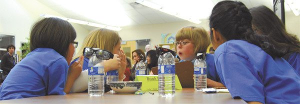 Snoqualmie Elementary students put their heads together to answer a question at the Battle of the Books.