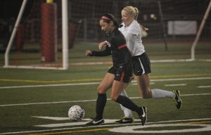 Mount Si's Karli White battles for possession against Sammamish on Oct. 15. The team moved and passed the ball a lot against a physical opponent—a recipe for success against future challengers.