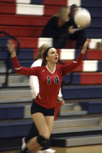 Haley Holmberg serves against the Rebels during Mount Si's three-set win on Halloween night. The Wildcats beat Juanita and Mercer Island in the league tournament last week to claim the Kingco title.