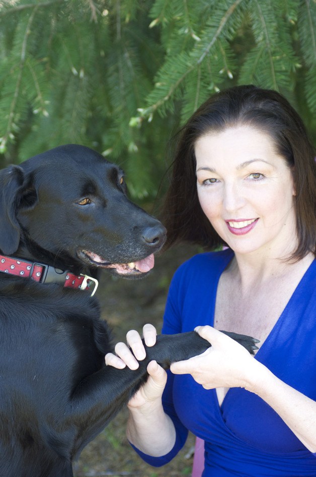 Animal communicator Joan Ranquet with dog Isabella.