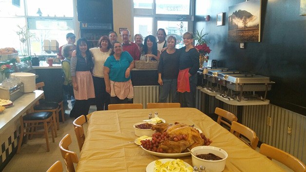 Volunteers with the “Angel in Your Own Neighborhood” community Thanksgiving dinner ready a spread on Thursday afternoon