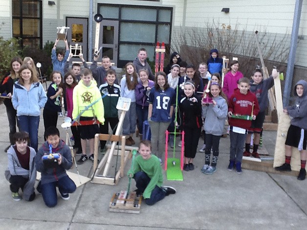 Students at Twin Falls Middle School in North Bend show off their collection of homemade catapults. Every sixth grader studied the scientific method as part of the forceful construction project.