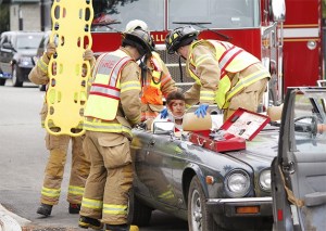 Snoqualmie firefighters tend to a boy portraying an injury victim in the intense educational event