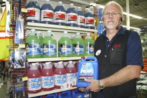 North Bend ACE assistant manager Niel shows part of the selection of winter auto care items.