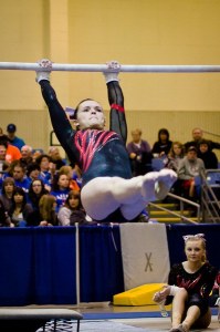 Mount Si’s Jenn Rogers twists skyward at the state gymnastics championships; she placed seventh in beam and fifth in the floor routine