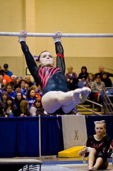 Mount Si’s Jenn Rogers twists skyward at the state gymnastics championships; she placed seventh in beam and fifth in the floor routine