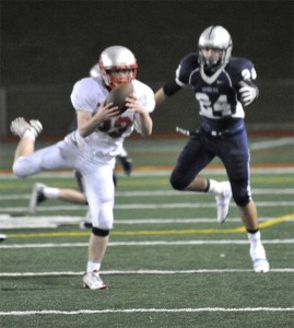 Mount Si junior Connor Deutsch pulls down a Glacier Peak pass in front of CJ Hawley to keep the Grizzlies from a late score in regulation play Friday