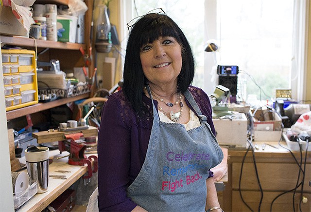 Heritage Gifts owner Denise Atkinson is surrounded by her crafting materials insider her North Bend studio.