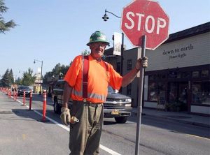 A flagger stops traffic during an earlier phase of Snoqualmie's infrastructure project in this file photo
