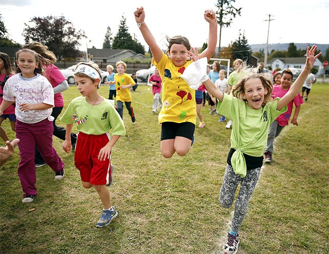 Two girls show off for the camera during the 13th annual walkathon at Fall City Elementary School.